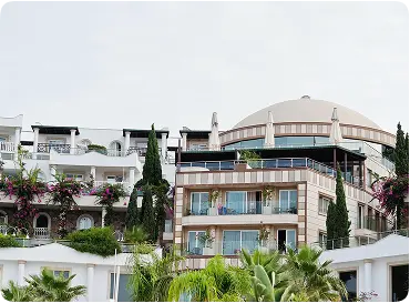 Luxury 4-star hotel exterior with stylish architecture, balconies, and lush greenery for a premium stay.